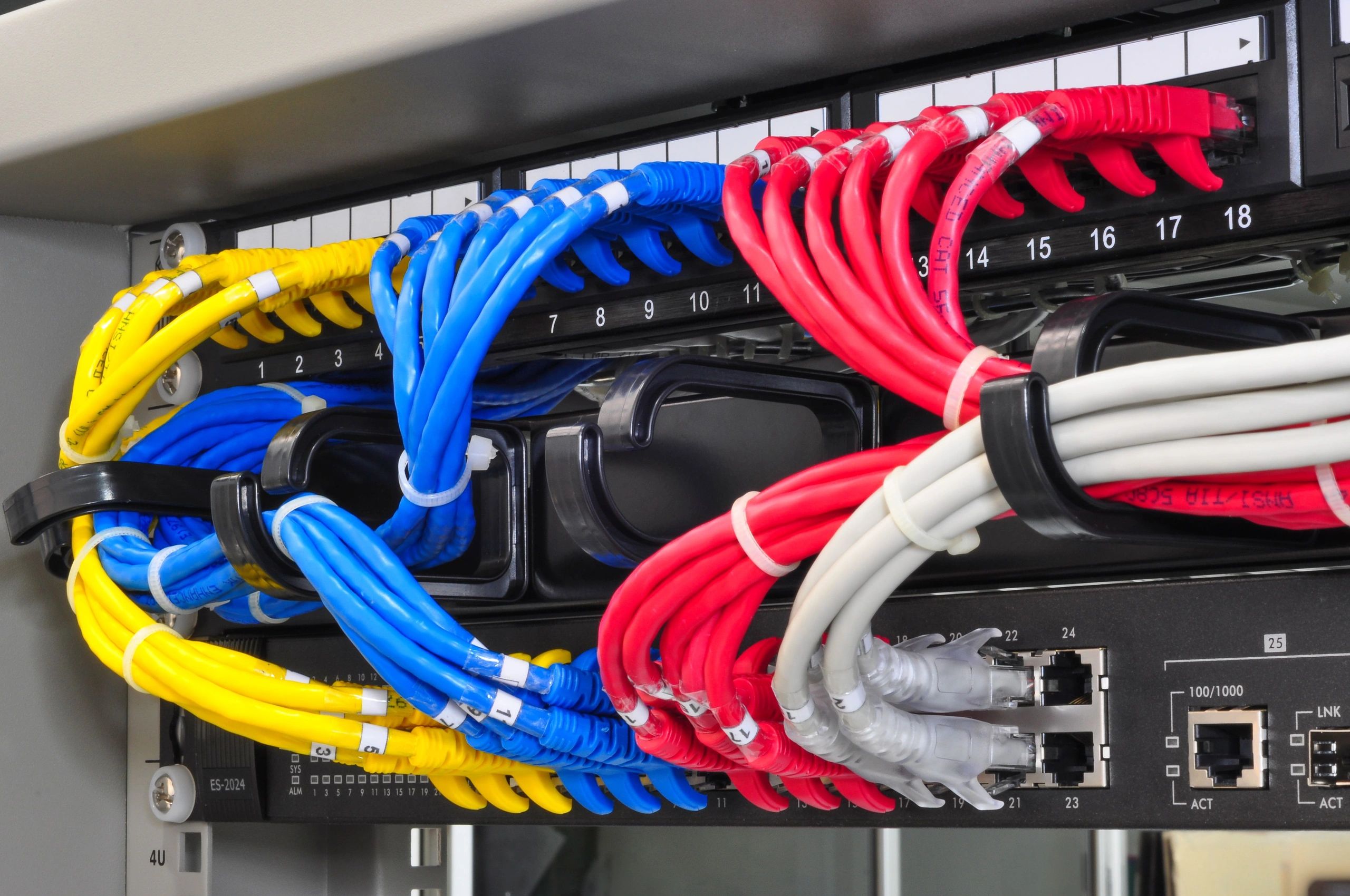 Close-up of a network rack with organized Ethernet cables